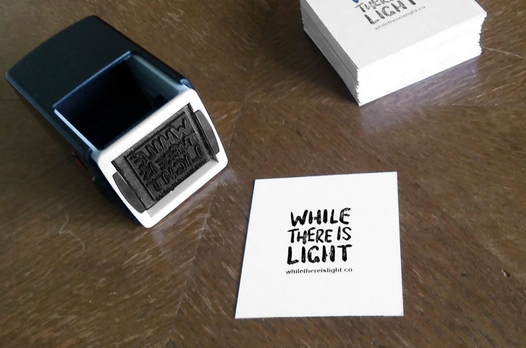 while there is light logo branding rubber stamp and business card